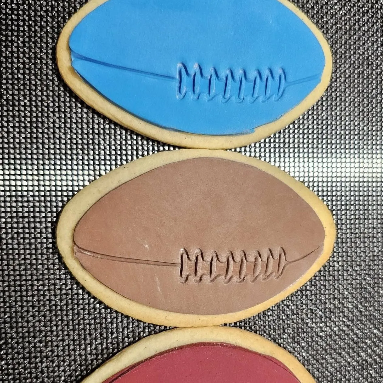 Footy, stitched in chocolate