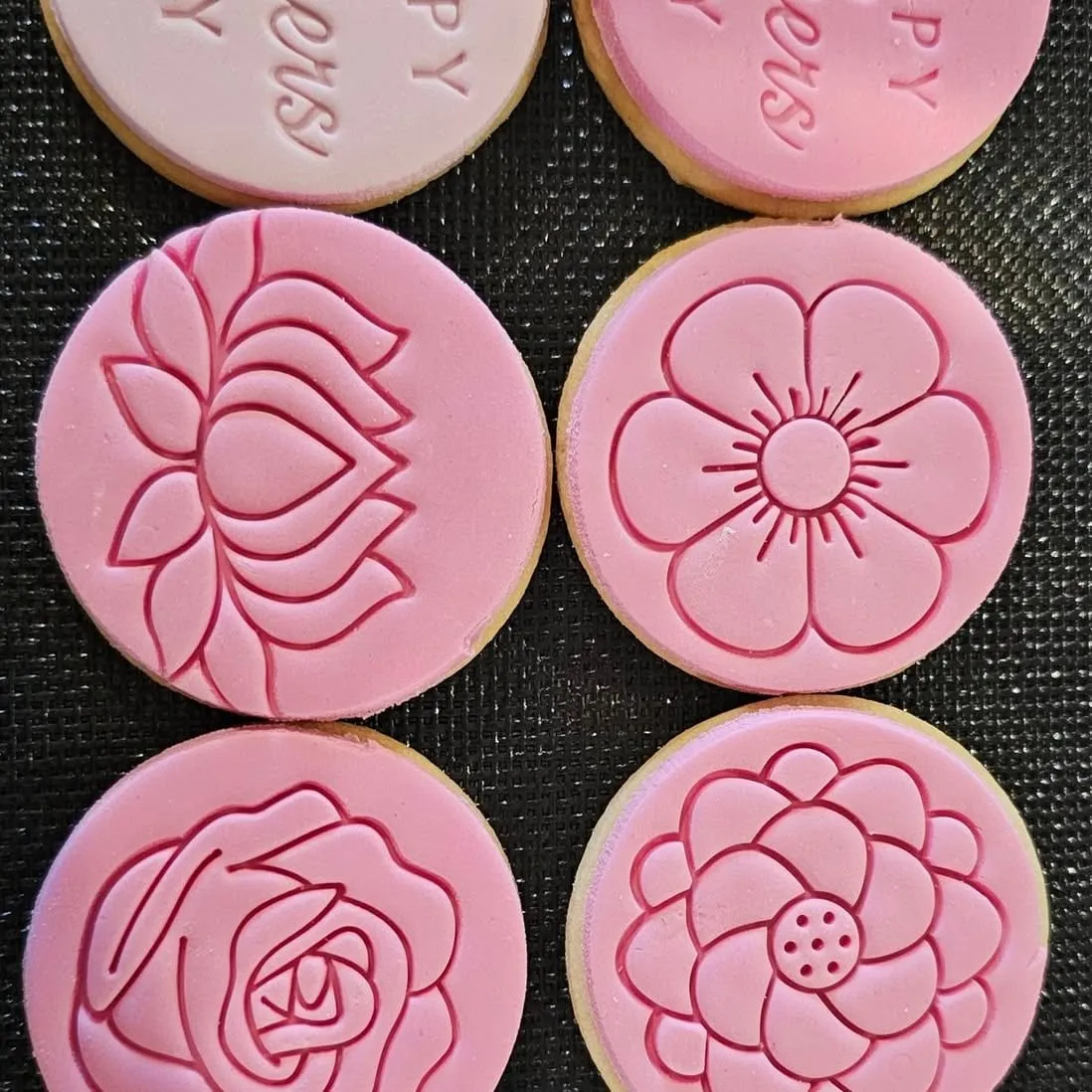 Roses pressed into pink fondant