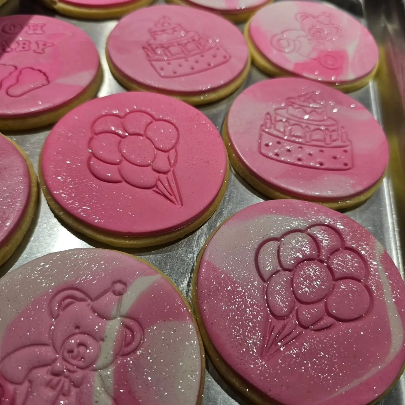 Pink rounds, a different design on each